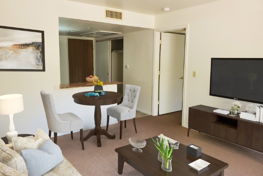 A second view photo of living room in one bedroom apartment at Christian Care Assisted Living in Cottonwood